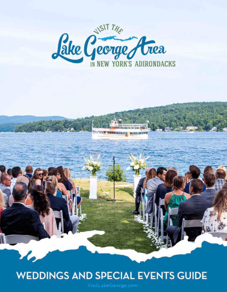 wedding guide cover, ceremony by lake george with cruise ship sailing by